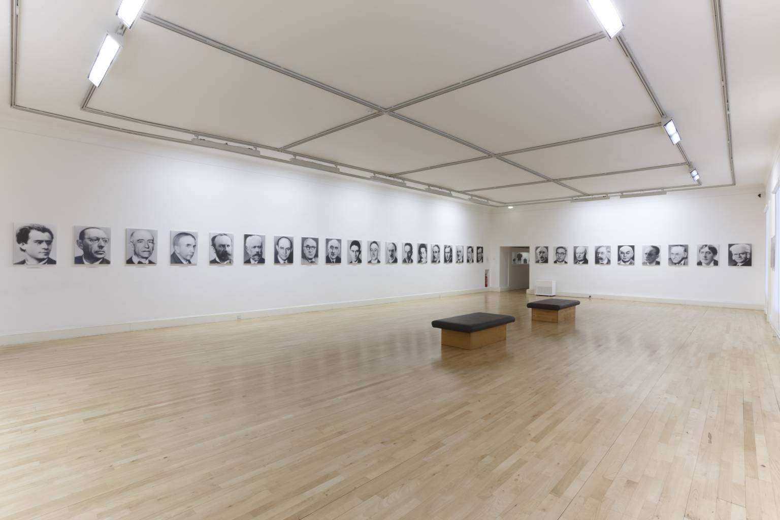 Installation view of 48 Portraits by Gerhardt Richter